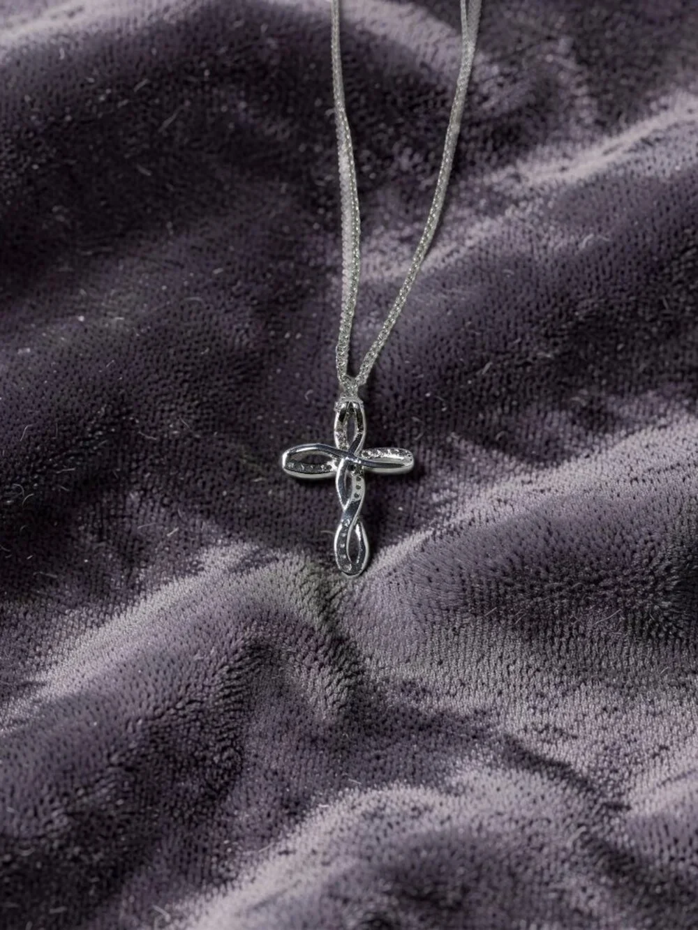 vintage Chrystal lined spiraled curled cross on a .925 sterling necklace